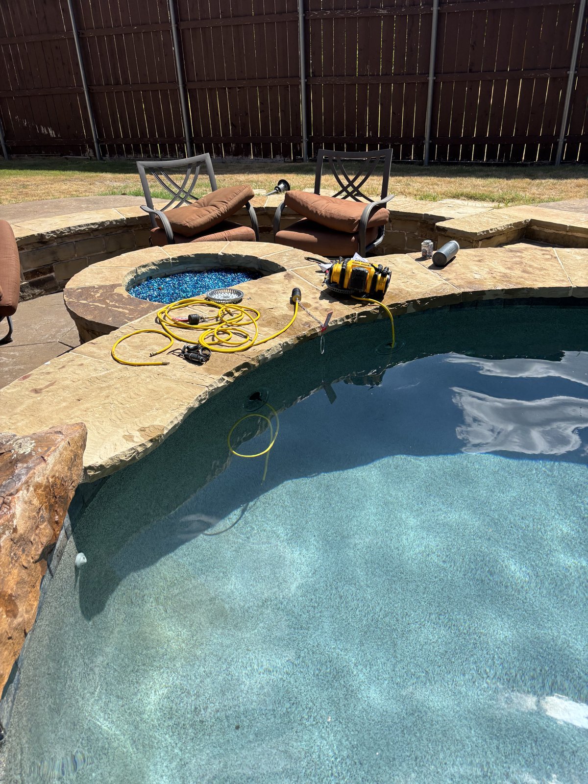 Pool and raised spa field photo from a separate Lone Star project, used to illustrate water-level observations