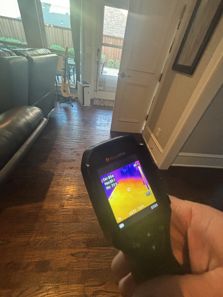 Thermal camera displaying warm spots in several rooms during a slab leak investigation